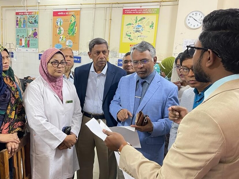 Rajib Biswas demonstrating printouts from inpatient management system at FMCH